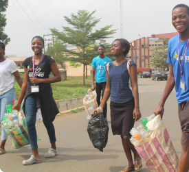 Image of members of Enactus Futa carrying a clean up exercise